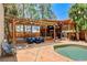 A backyard oasis with covered patio, outdoor kitchen, pool and elegant dining set at 5260 N Jones Blvd, Las Vegas, NV 89130