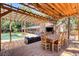 This luxurious backyard features a covered patio, swimming pool, and an elegant dining set at 5260 N Jones Blvd, Las Vegas, NV 89130