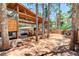 Backyard features a covered patio with an outdoor kitchen, dining area, and playground at 5260 N Jones Blvd, Las Vegas, NV 89130