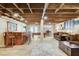 Open basement design includes a bar, pool table, comfortable seating, and exposed ceiling beams at 5260 N Jones Blvd, Las Vegas, NV 89130