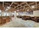 Spacious finished basement featuring a bar area and cozy seating arrangements with exposed wood ceiling at 5260 N Jones Blvd, Las Vegas, NV 89130