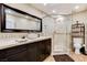 Bathroom featuring walk-in shower, stone countertops, bowl sink and wood flooring at 5260 N Jones Blvd, Las Vegas, NV 89130