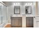 Bathroom featuring double sinks, modern fixtures, and walk in shower at 5260 N Jones Blvd, Las Vegas, NV 89130