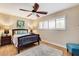 This cozy bedroom features a ceiling fan, light wood flooring, and large windows at 5260 N Jones Blvd, Las Vegas, NV 89130