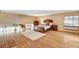 Spacious bedroom with hardwood floors, large window, and a comfortable bed at 5260 N Jones Blvd, Las Vegas, NV 89130