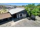 Aerial view of the house, showcasing modern architecture and ample parking, with bikes near the entrance at 5260 N Jones Blvd, Las Vegas, NV 89130