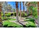 Lush front yard with mature landscaping, trees and bridge to the home's entryway at 5260 N Jones Blvd, Las Vegas, NV 89130