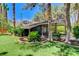 Charming covered garage surrounded by lush landscaping and mature trees at 5260 N Jones Blvd, Las Vegas, NV 89130
