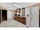 A simple kitchen with cabinetry, modern appliances, and tiled floor, ideal for meal preparation at 5260 N Jones Blvd, Las Vegas, NV 89130