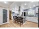 Modern kitchen with white cabinetry, stainless steel appliances, and a large island at 5260 N Jones Blvd, Las Vegas, NV 89130