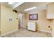 Practical laundry room with tile flooring, simple cabinets, and washer/dryer hookups for convenience at 5260 N Jones Blvd, Las Vegas, NV 89130