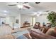 Open-concept living area featuring ceiling fans, hardwood floors, comfortable seating, and lots of space at 5260 N Jones Blvd, Las Vegas, NV 89130