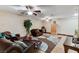 Comfortable living room with leather seating and area rug beneath ceiling fans at 5260 N Jones Blvd, Las Vegas, NV 89130