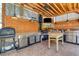 The outdoor kitchen features stainless steel appliances, a sink, and a convenient work table at 5260 N Jones Blvd, Las Vegas, NV 89130