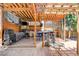Outdoor kitchen with stainless steel appliances, covered patio, bar seating and sun loungers at 5260 N Jones Blvd, Las Vegas, NV 89130
