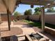 Spacious backyard featuring a fire pit, patio area, garden, and desert landscaping at 5363 S Juneau St, Pahrump, NV 89061