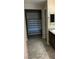 Bathroom featuring tile flooring and a shelving system within the walk in closet at 5363 S Juneau St, Pahrump, NV 89061