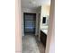 Bathroom with long vanity, walk-in closet and grey tile flooring at 5363 S Juneau St, Pahrump, NV 89061