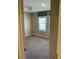 This bedroom features a window with wooden shutters, neutral carpet, and modern ceiling fan at 5363 S Juneau St, Pahrump, NV 89061