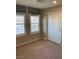 This bedroom features two windows with wooden shutters and neutral carpet at 5363 S Juneau St, Pahrump, NV 89061