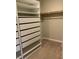 An organized walk-in closet featuring built-in shelving and drawers at 5363 S Juneau St, Pahrump, NV 89061