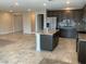 Open kitchen featuring stainless steel appliances, granite countertops, and an island at 5363 S Juneau St, Pahrump, NV 89061