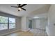 Bright bedroom with wood-look flooring, a ceiling fan, and access to a sliding glass door at 555 E Silverado Ranch Blvd # 2129, Las Vegas, NV 89183
