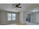 Spacious bedroom with a ceiling fan and an en-suite bathroom featuring sliding glass doors at 555 E Silverado Ranch Blvd # 2129, Las Vegas, NV 89183