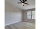 Clean bedroom with sleek flooring, a ceiling fan, and a large window offering natural light at 555 E Silverado Ranch Blvd # 2129, Las Vegas, NV 89183