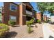Multi-story condo building with well-maintained landscaping and a walking path at 555 E Silverado Ranch Blvd # 2129, Las Vegas, NV 89183