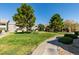 Beautifully landscaped common area featuring mature shade trees and grassy lawns in a well-maintained complex at 555 E Silverado Ranch Blvd # 2129, Las Vegas, NV 89183