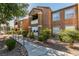 Charming condo complex with well-maintained landscaping and inviting walkway at 555 E Silverado Ranch Blvd # 2129, Las Vegas, NV 89183