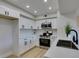 Modern kitchen featuring stainless steel appliances and white cabinetry at 555 E Silverado Ranch Blvd # 2129, Las Vegas, NV 89183
