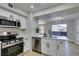 Updated kitchen with stainless steel appliances and a breakfast bar at 555 E Silverado Ranch Blvd # 2129, Las Vegas, NV 89183