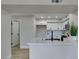 Modern kitchen featuring white cabinets, quartz countertops, and a stainless steel microwave at 555 E Silverado Ranch Blvd # 2129, Las Vegas, NV 89183