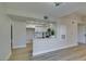 Updated kitchen view from living area with white cabinets and modern hardware at 555 E Silverado Ranch Blvd # 2129, Las Vegas, NV 89183