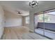 Bright living room with vaulted ceilings, ceiling fan, and balcony access at 555 E Silverado Ranch Blvd # 2129, Las Vegas, NV 89183