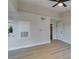 Bright living area features wood-look floors, a ceiling fan, and lots of natural light at 555 E Silverado Ranch Blvd # 2129, Las Vegas, NV 89183