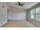 Bright living area features wood-look floors, a ceiling fan, and lots of natural light at 555 E Silverado Ranch Blvd # 2129, Las Vegas, NV 89183