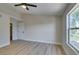 Bright living area features wood-look floors, a ceiling fan, and lots of natural light at 555 E Silverado Ranch Blvd # 2129, Las Vegas, NV 89183