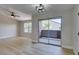 Living room featuring a ceiling fan and access to a balcony at 555 E Silverado Ranch Blvd # 2129, Las Vegas, NV 89183