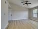 Bright living area features wood-look floors, a ceiling fan, and lots of natural light at 555 E Silverado Ranch Blvd # 2129, Las Vegas, NV 89183