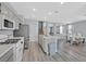 Contemporary kitchen with an island and views into dining room at 5923 Halehaven Dr, Las Vegas, NV 89110
