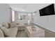 Inviting living room with plush seating, modern décor, and ample natural light at 5923 Halehaven Dr, Las Vegas, NV 89110