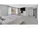 Spacious main bedroom with plush gray carpets, large windows, and neutral-colored walls at 5923 Halehaven Dr, Las Vegas, NV 89110