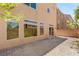 Home's exterior showcasing a brick paver patio, offering an excellent outdoor living and entertainment space at 6014 Belvedere Canyon Ave, Las Vegas, NV 89139