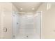 This bathroom boasts a glass enclosed shower with marble surround and modern fixtures at 6014 Belvedere Canyon Ave, Las Vegas, NV 89139