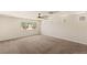 Spacious bedroom showcasing neutral paint, carpet and window overlooking green space at 6014 Belvedere Canyon Ave, Las Vegas, NV 89139