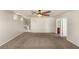 Spacious bedroom featuring neutral paint, plush carpeting, and easy access to the stairway and bathroom at 6014 Belvedere Canyon Ave, Las Vegas, NV 89139