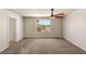 A bedroom with light walls, carpet flooring, and a ceiling fan at 6014 Belvedere Canyon Ave, Las Vegas, NV 89139